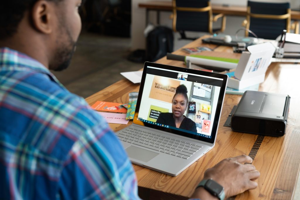 Interviewee during an online interview using a laptop on a desk